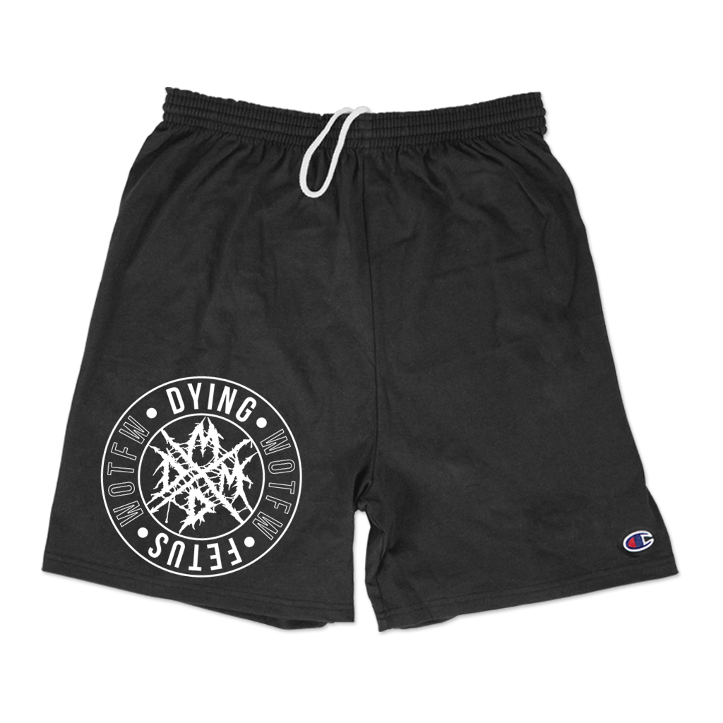 Dying Fetus Band'S MDDM Badge design printed on the right thigh on black cotton Champion brand shorts with pockets.  Short specs include: 6 oz. 100% cotton jersey, elastic waistband with drawcord, 9" inseam, side pockets, and "C" logo on left bottom hem.